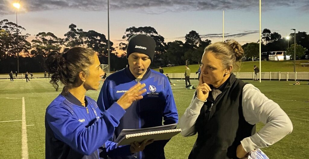 MWFA Coach Mentors Patricia Faria and Nina Sallenave have a discussion with MWFA Coach Development Manager Eugene Lawrenz.